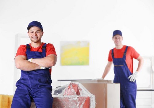 Removal team planning a Kensington home move with boxes and furniture