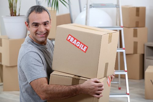Removal team supporting a Kensington home move with packed boxes and furniture