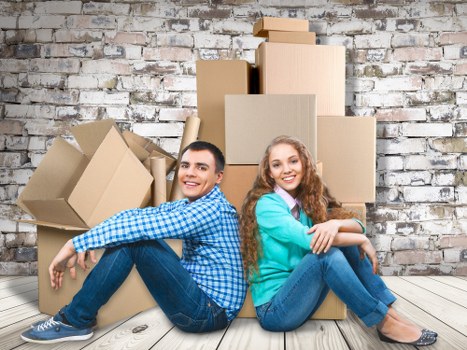 Packed boxes and furniture ready for a local move in Kensington