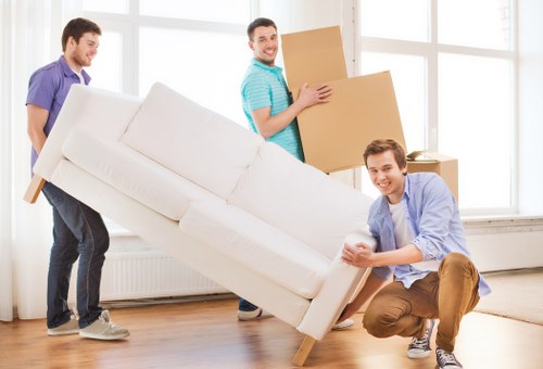 Furniture being carefully moved from a local Kensington home