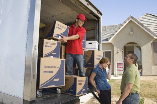 Unloading home belongings into a Kensington property room by room