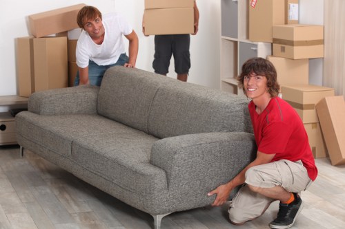 Man and van loading furniture for a local Kensington relocation