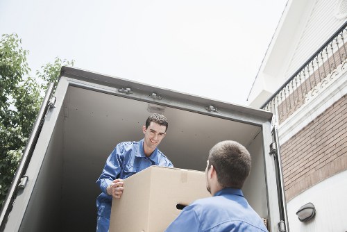 Moving truck and packed boxes outside a Kensington property